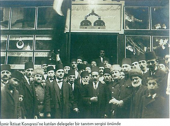 Delegates attending the Izmir Economic Congress in front of a promotional exhibition